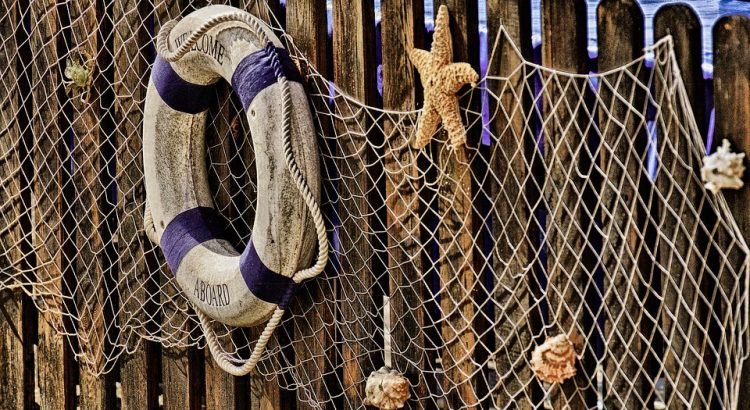 Hanging fishing net and lifebuoy